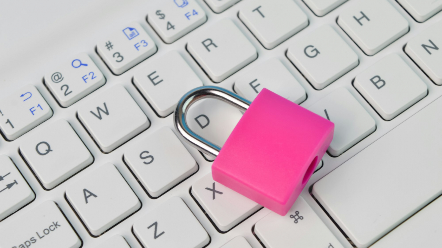 Padlock and laptop keyboard. Cyber security concept