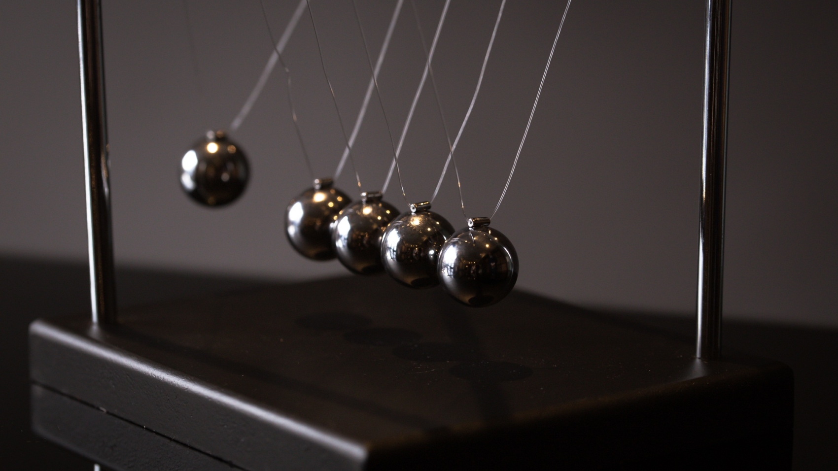 Newton cradle representing momentum
