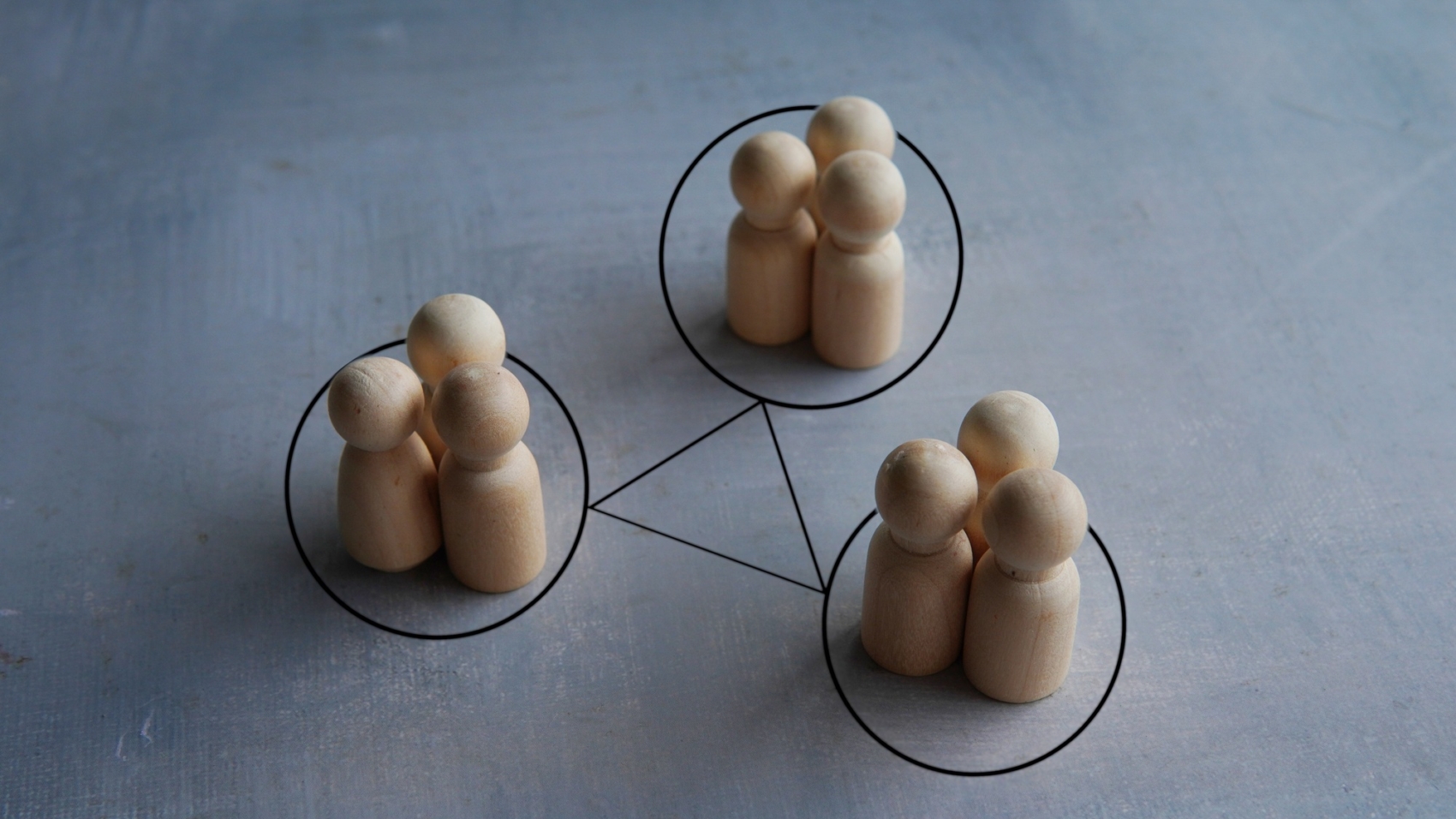 Groups of people are connected by lines.